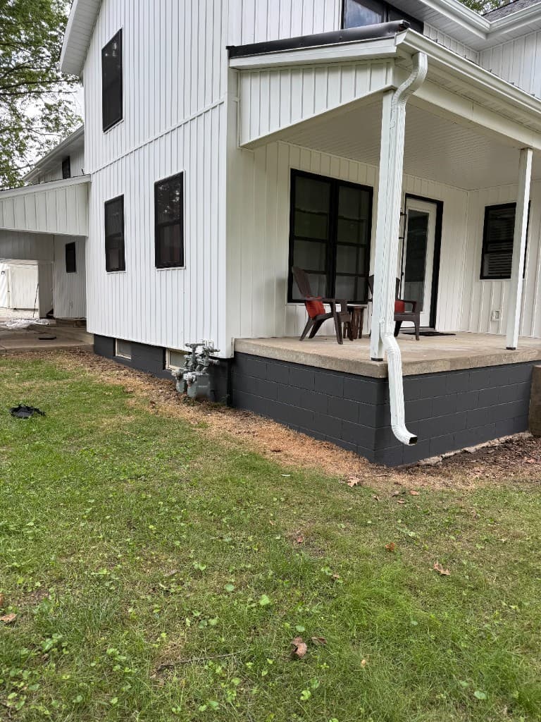 Refreshed side foundation wall after coating.