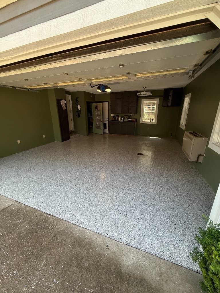 Finished Coyote flake floor coating with olive green garage walls.