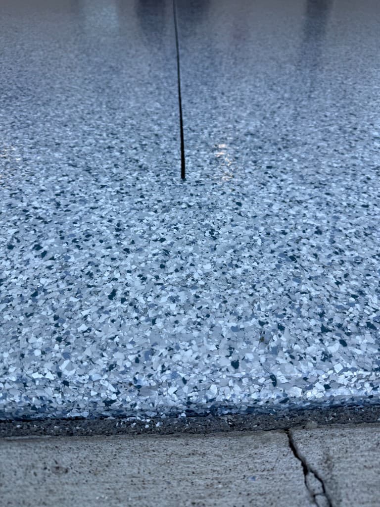 Tidal Wave flake coating finished cleanly at the garage threshold.